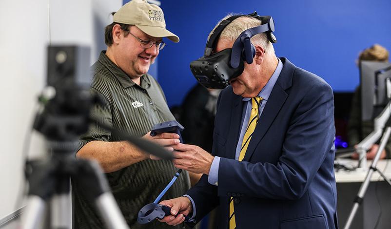 a man with virtual reality equipment