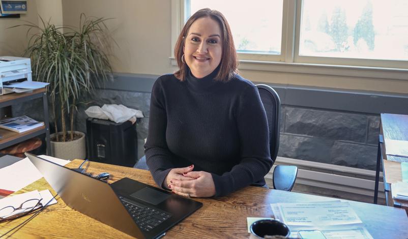 Amy Guardado sitting in her office